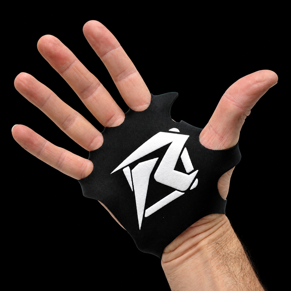 Hand wearing a black Risk Racing palm protector, palm side, on black